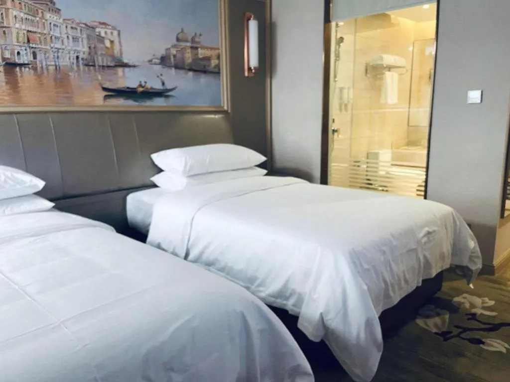 Bed in Vienna Hotel Shandong Qingdao Jiaodong International Airport Hai'er Avenue
