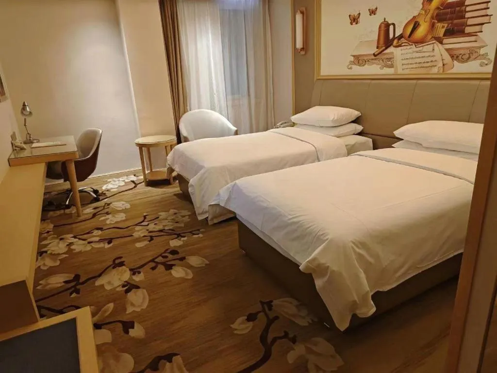 Bed in Vienna Hotel Shandong Qingdao Jiaodong International Airport Hai'er Avenue
