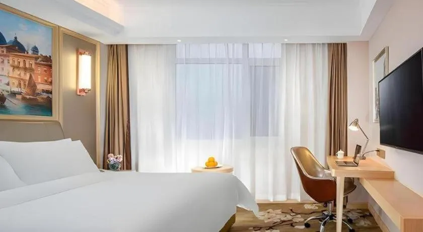 Bed in Vienna Hotel Shandong Qingdao Jiaodong International Airport Hai'er Avenue