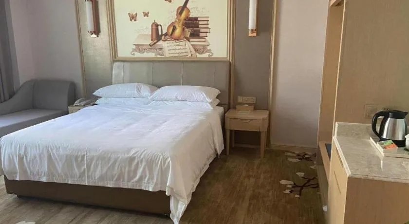 Bed in Vienna Hotel Shandong Qingdao Jiaodong International Airport Hai'er Avenue