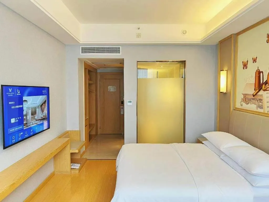 Bed in Vienna Hotel Zhengzhou Fengchan Road Fortune Plaza