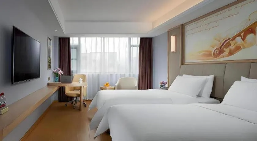 Bed in Vienna Hotel Zhengzhou Fengchan Road Fortune Plaza