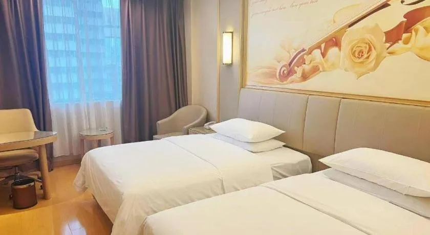 Bed in Vienna Hotel Zhengzhou Fengchan Road Fortune Plaza