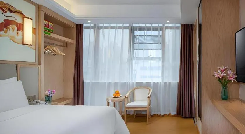 Bed in Vienna Hotel Zhengzhou Fengchan Road Fortune Plaza