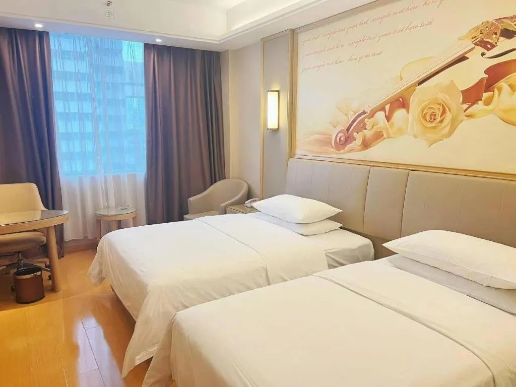 Bed in Vienna Hotel Zhengzhou Fengchan Road Fortune Plaza