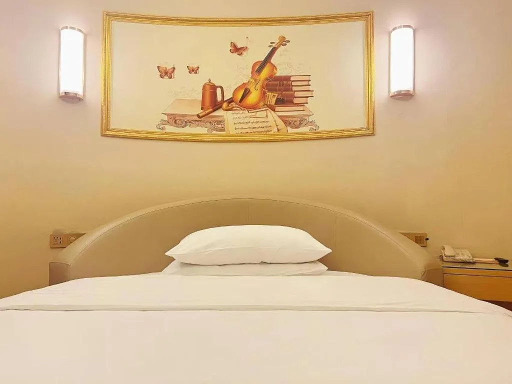 Bed in Vienna Hotel Zhengzhou Fengchan Road Fortune Plaza