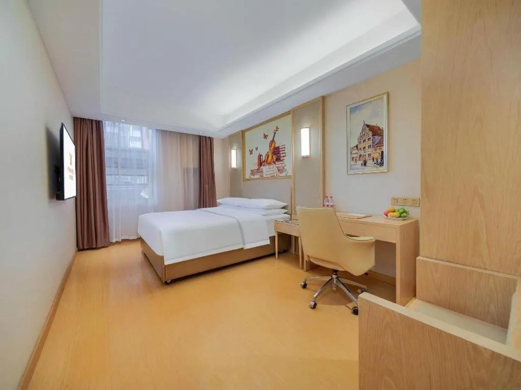 Bed in Vienna Hotel Zhengzhou Fengchan Road Fortune Plaza