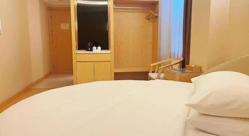 Bed in Vienna Hotel Zhengzhou Fengchan Road Fortune Plaza