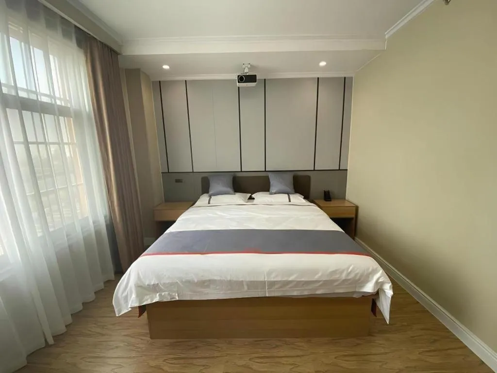 Bed in Jun Light Hotel Jiangxi Jiujiang Yongxiu County Dongyong Mall