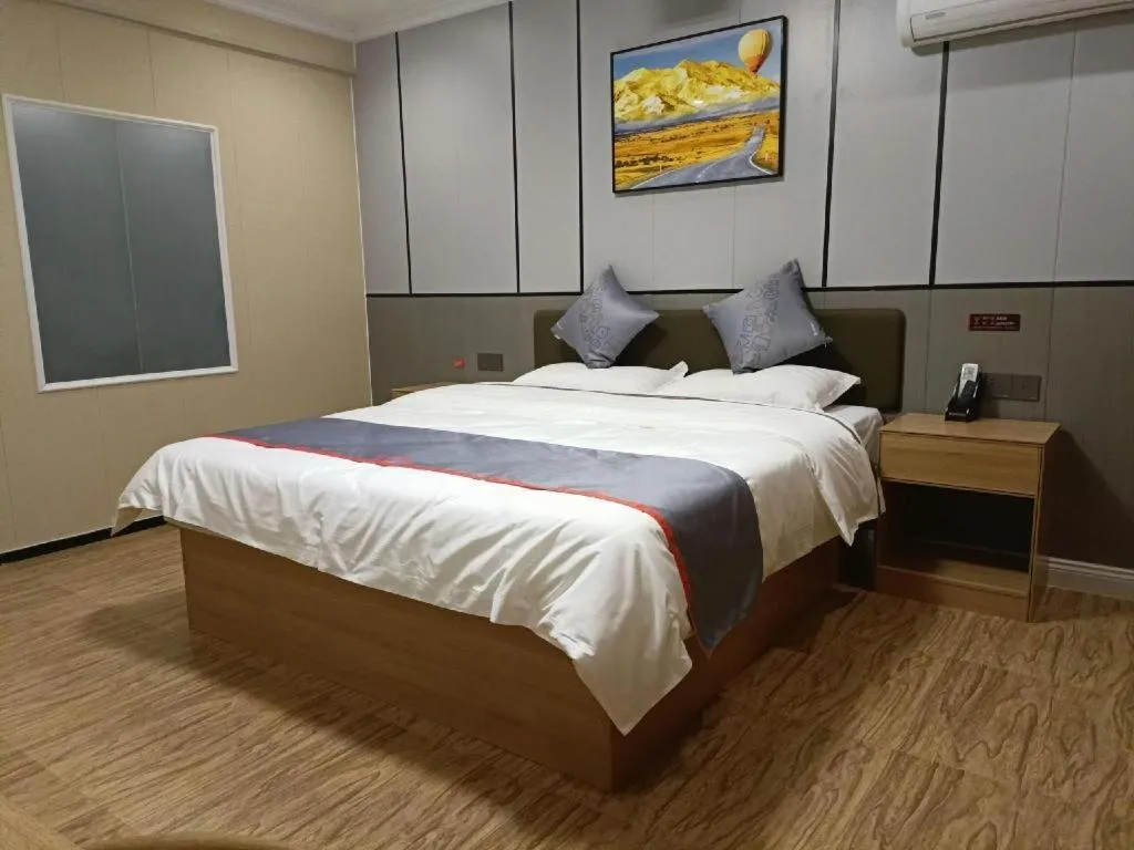 Bed in Jun Light Hotel Jiangxi Jiujiang Yongxiu County Dongyong Mall