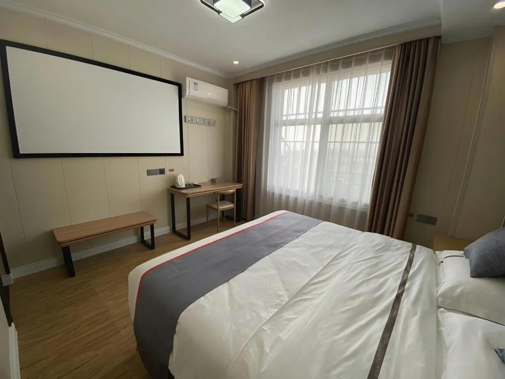 Bed in Jun Light Hotel Jiangxi Jiujiang Yongxiu County Dongyong Mall