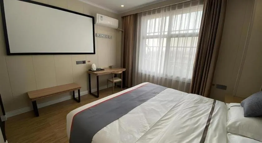 Bed in Jun Light Hotel Jiangxi Jiujiang Yongxiu County Dongyong Mall