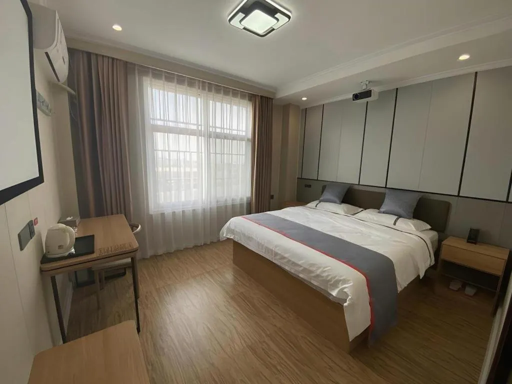 Bed in Jun Light Hotel Jiangxi Jiujiang Yongxiu County Dongyong Mall