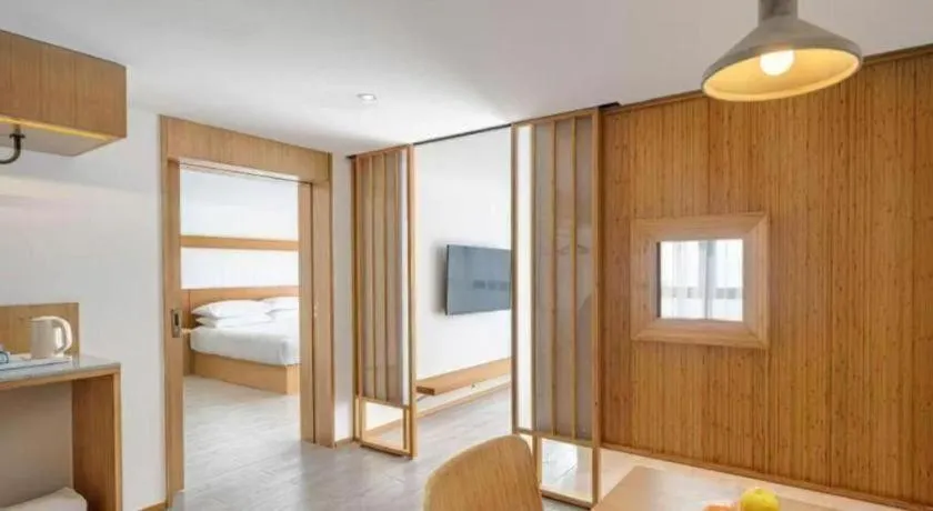 Bed in Meijin All Suites Hotel Suzhou