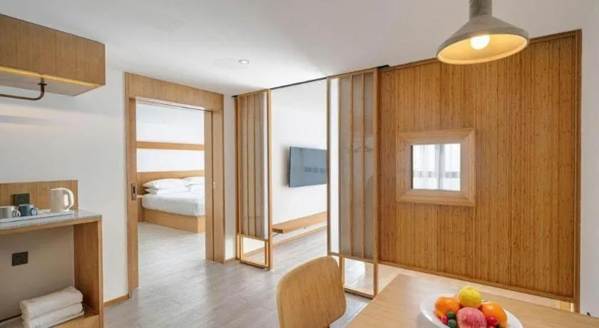 Bed in Meijin All Suites Hotel Suzhou