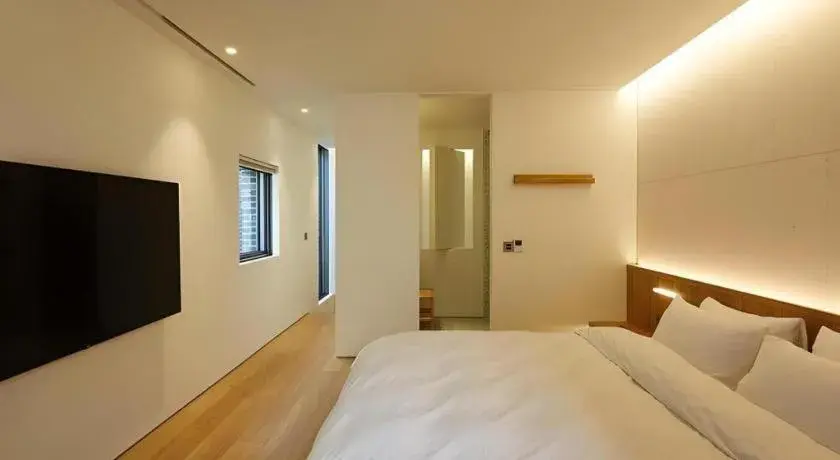 Bed in Namu Hotel Bed in Namu Hotel