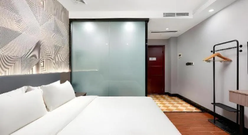 Bed in Borrman Hotel Huizhou Danshui High-speed Railway Huiyang Station