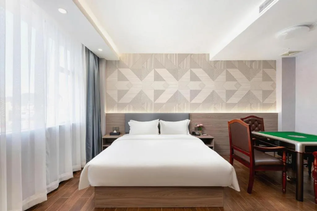 Bed in Borrman Hotel Huizhou Danshui High-speed Railway Huiyang Station