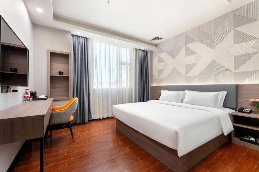 Bed in Borrman Hotel Huizhou Danshui High-speed Railway Huiyang Station