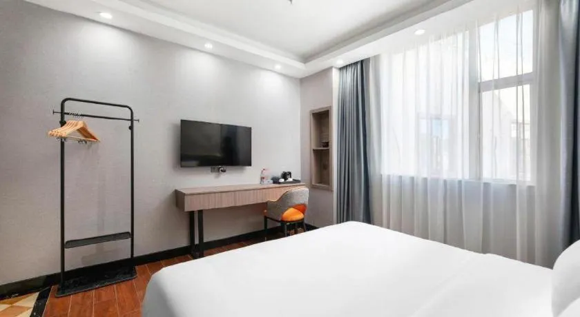 Bed in Borrman Hotel Huizhou Danshui High-speed Railway Huiyang Station