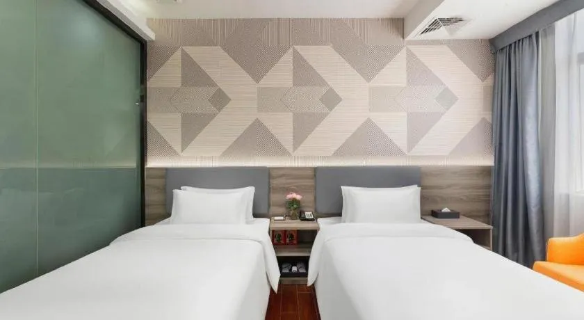 Bed in Borrman Hotel Huizhou Danshui High-speed Railway Huiyang Station