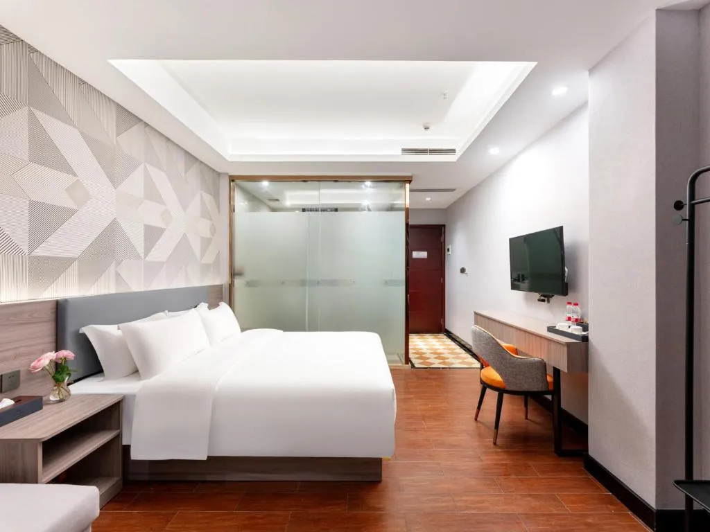 Bed in Borrman Hotel Huizhou Danshui High-speed Railway Huiyang Station