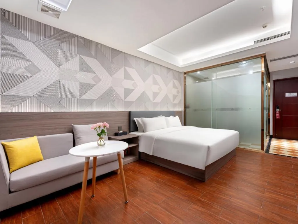 Bed in Borrman Hotel Huizhou Danshui High-speed Railway Huiyang Station