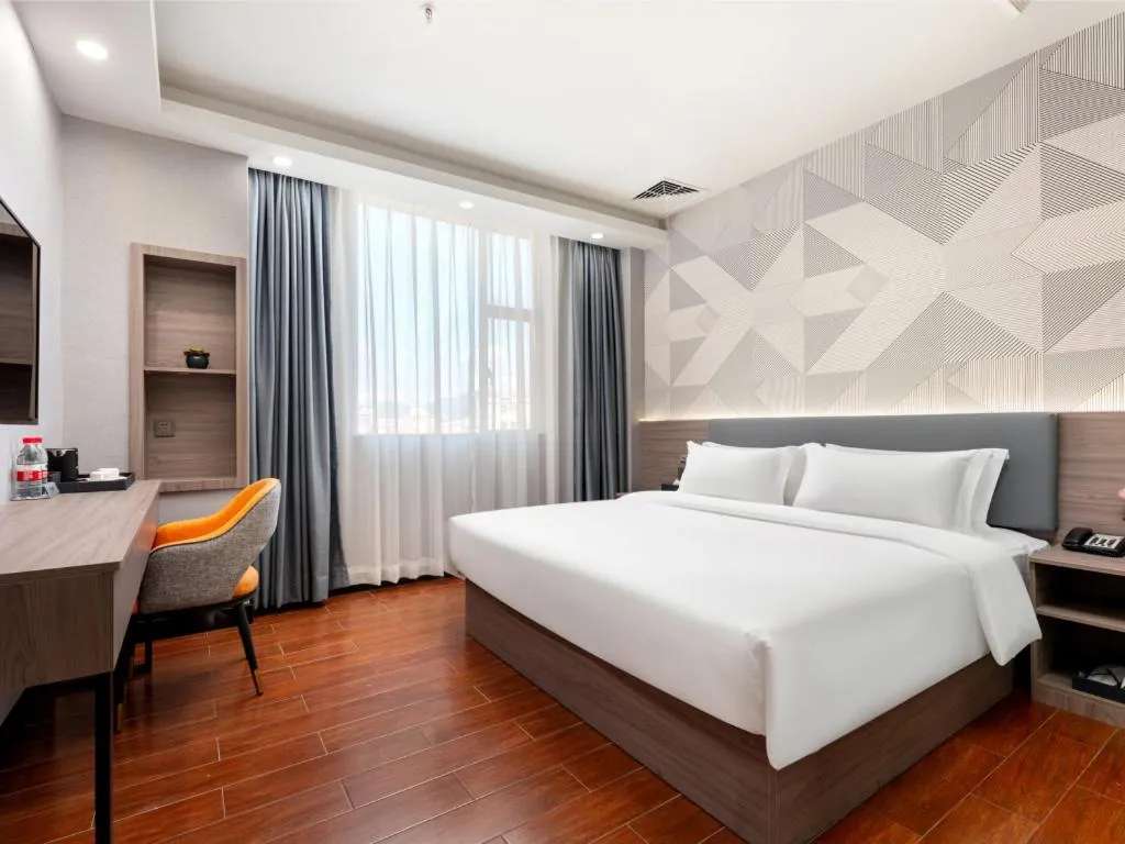 Bed in Borrman Hotel Huizhou Danshui High-speed Railway Huiyang Station