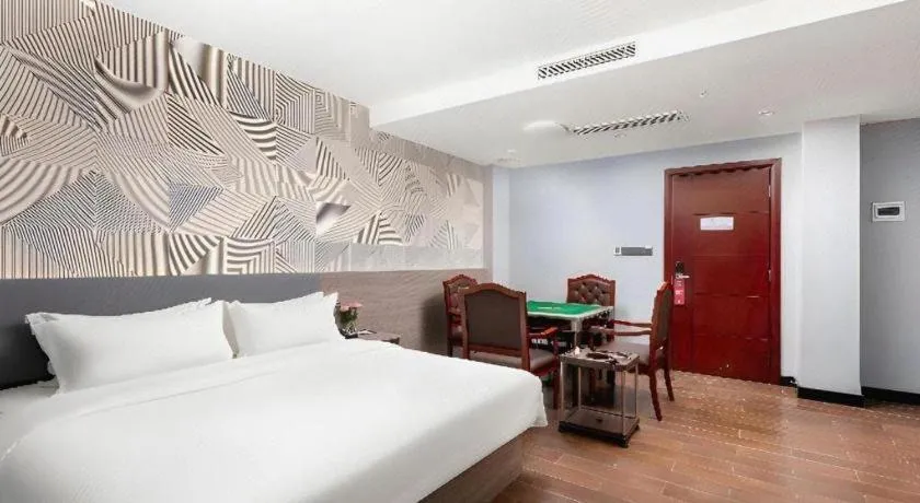 Bed in Borrman Hotel Huizhou Danshui High-speed Railway Huiyang Station