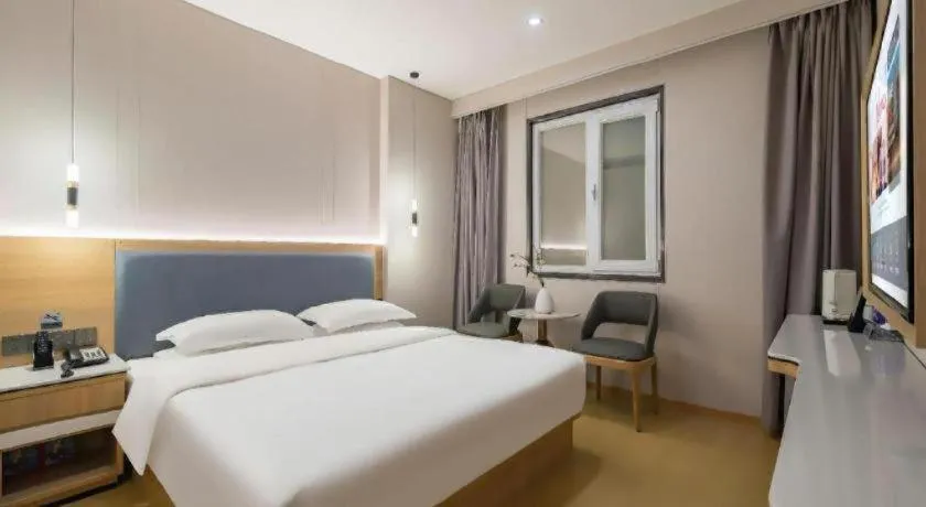 Bed in Borrman Hotel South Beijing Railway Station Caoqiao Station