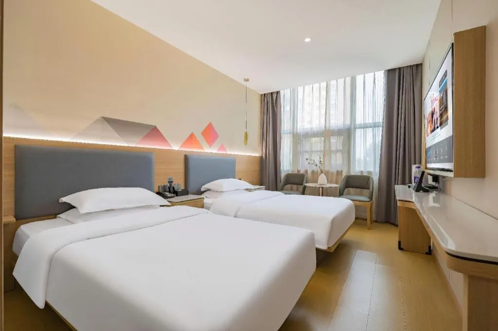 Bed in Borrman Hotel South Beijing Railway Station Caoqiao Station