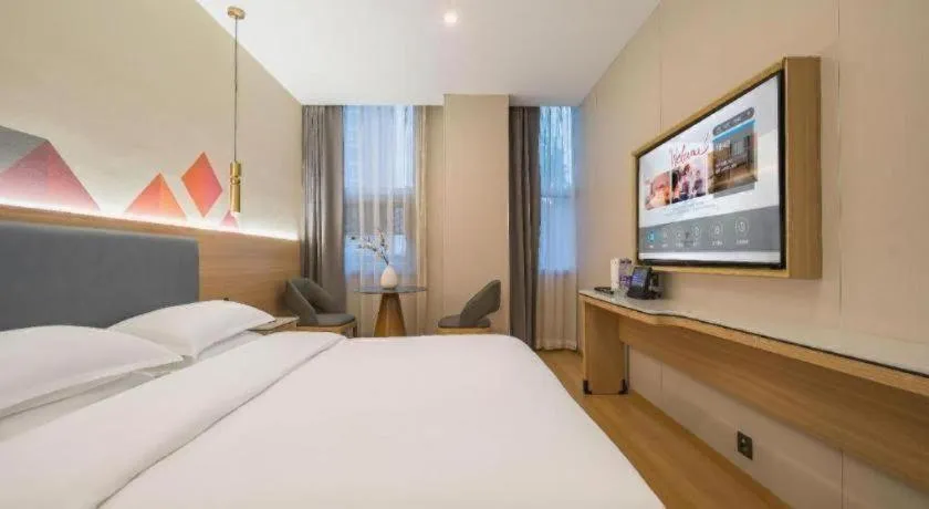 Bed in Borrman Hotel South Beijing Railway Station Caoqiao Station