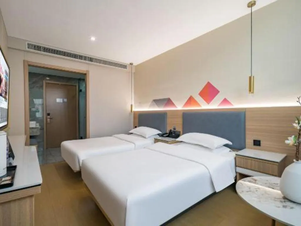 Bed in Borrman Hotel South Beijing Railway Station Caoqiao Station