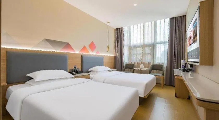 Bed in Borrman Hotel South Beijing Railway Station Caoqiao Station