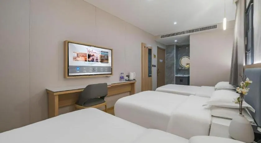 Bed in Borrman Hotel South Beijing Railway Station Caoqiao Station