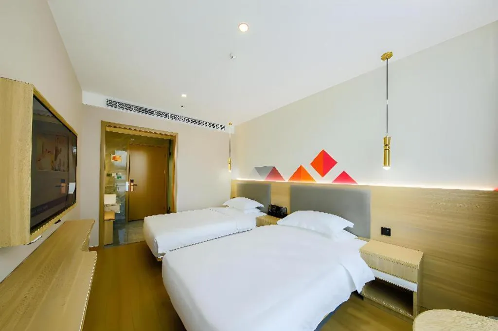 Bed in Borrman Hotel South Beijing Railway Station Caoqiao Station