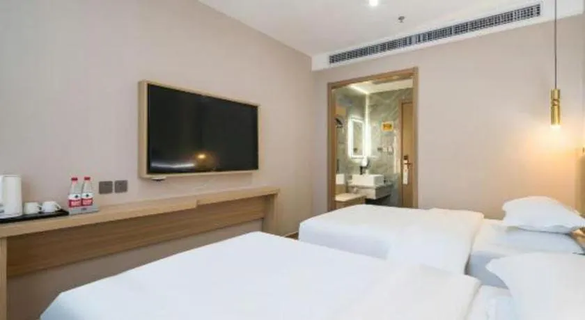 Bed in Borrman Hotel South Beijing Railway Station Caoqiao Station