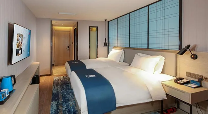 Bed in Echarm Hotel Chengdu Global Center Century City New Exhibition