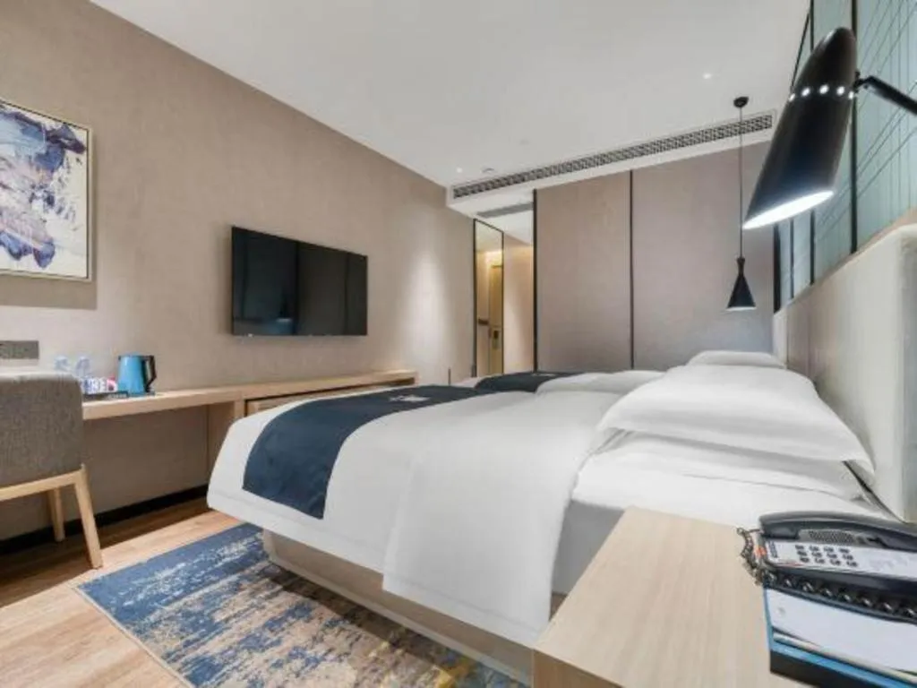 Bed in Echarm Hotel Chengdu Global Center Century City New Exhibition