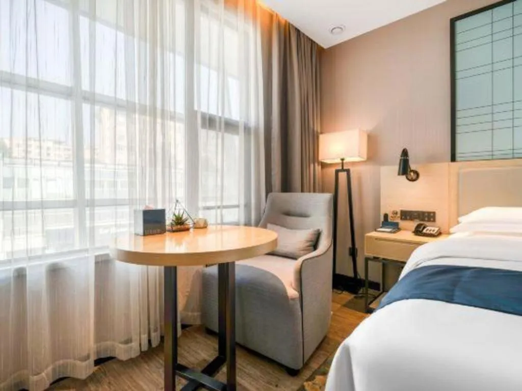 Bed in Echarm Hotel Chengdu Global Center Century City New Exhibition