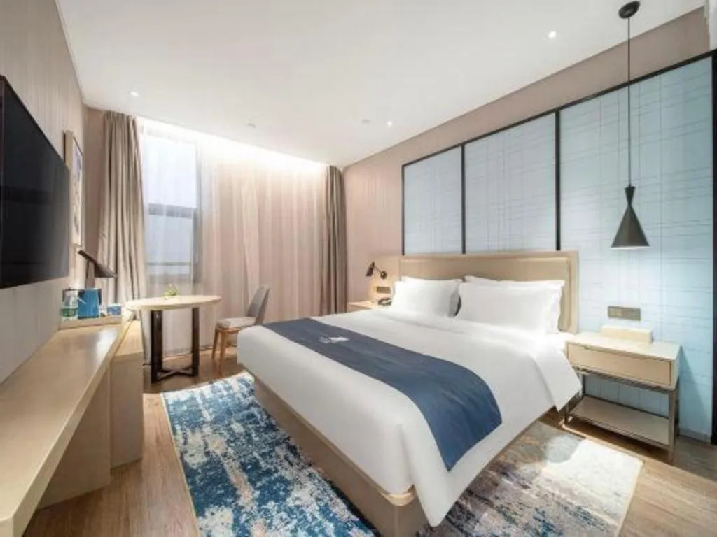 Bed in Echarm Hotel Chengdu Global Center Century City New Exhibition