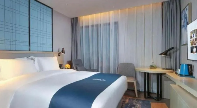 Bed in Echarm Hotel Chengdu Global Center Century City New Exhibition