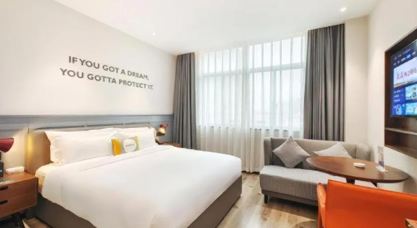 Bed in Premier City Comfort Hotel Hechi Luocheng Central Plaza