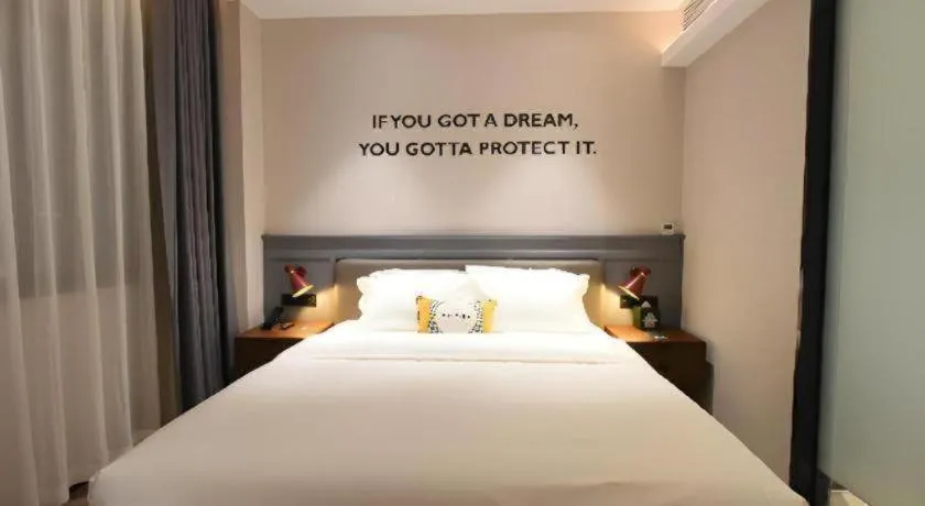 Bed in Premier City Comfort Hotel Hechi Luocheng Central Plaza