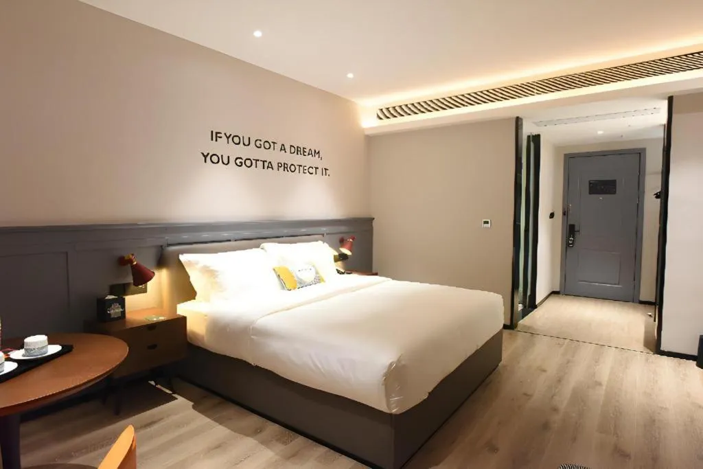 Bed in Premier City Comfort Hotel Hechi Luocheng Central Plaza