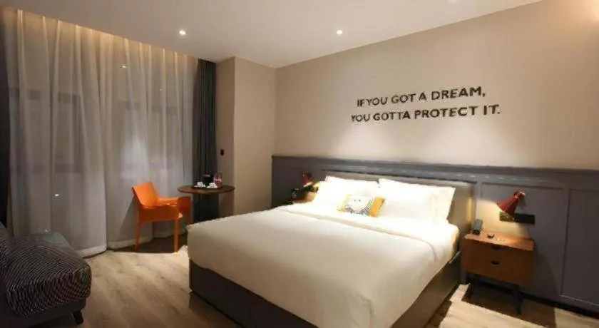 Bed in Premier City Comfort Hotel Hechi Luocheng Central Plaza