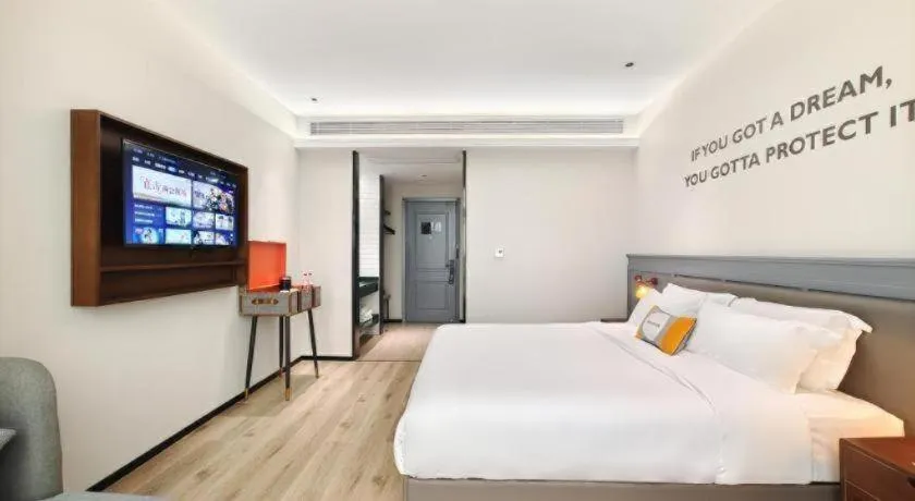 Bed in Premier City Comfort Hotel Hechi Luocheng Central Plaza