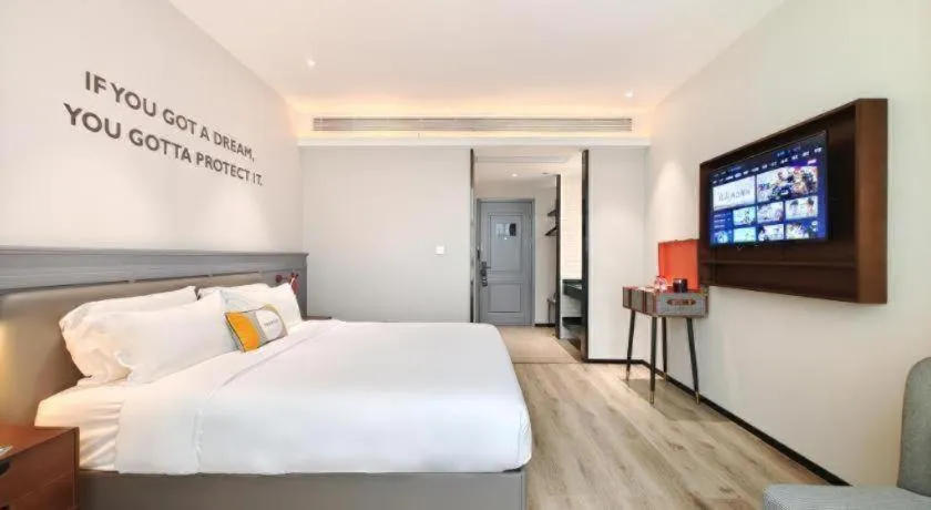 Bed in Premier City Comfort Hotel Hechi Luocheng Central Plaza