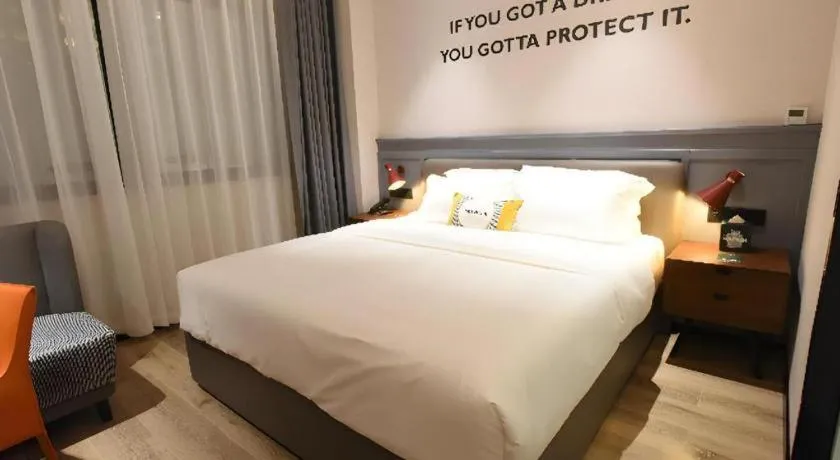 Bed in Premier City Comfort Hotel Hechi Luocheng Central Plaza