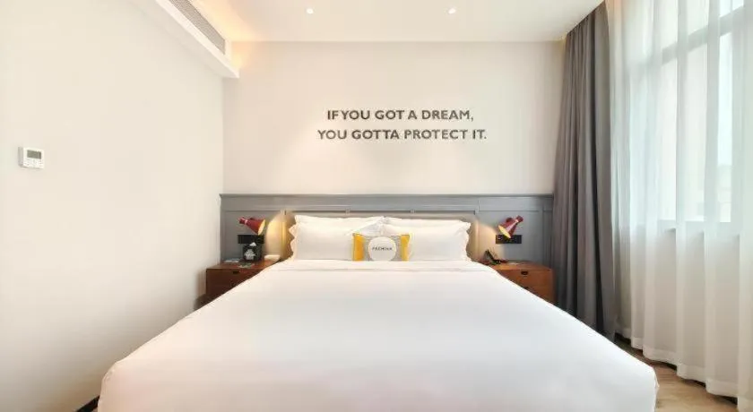 Bed in Premier City Comfort Hotel Hechi Luocheng Central Plaza